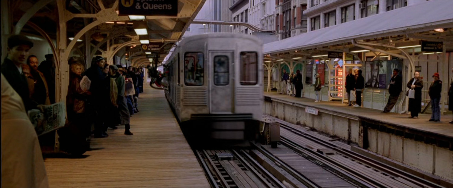Train speeds through elevated train station.