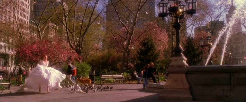 Mary Jane in bridal dress in park.