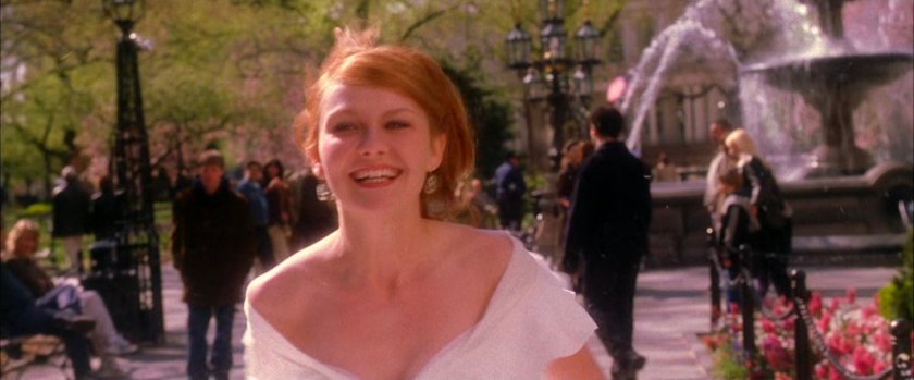 Mary Jane in bridal dress in park.