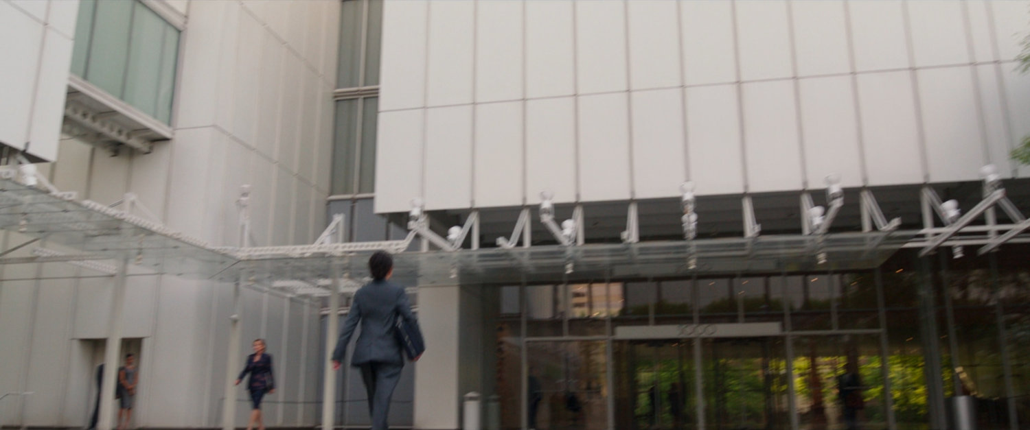 Jen Walters walks across the courtyard towards the front door of GLK&H.