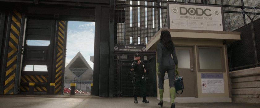 She-Hulk talking to a guard in front of the Department of Damage Control Supermax Prison.
