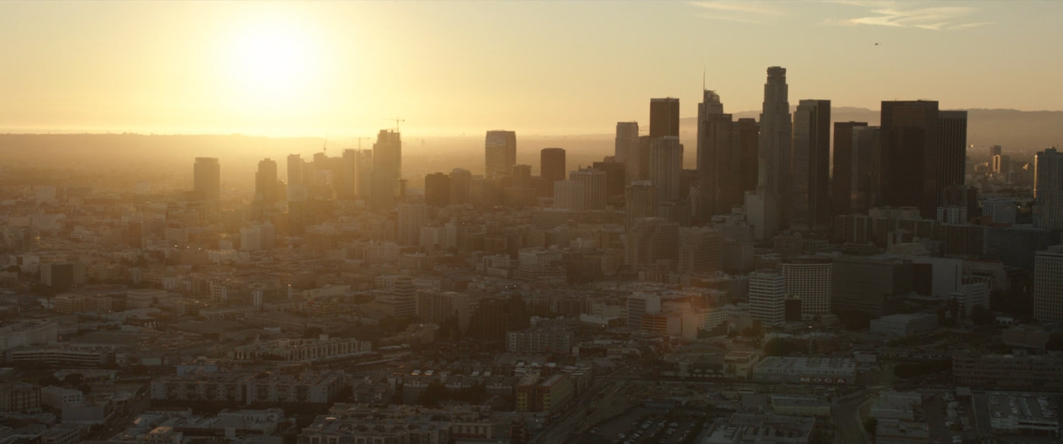 Aerial shot of downtown Los Angeles at sunset, looking West.