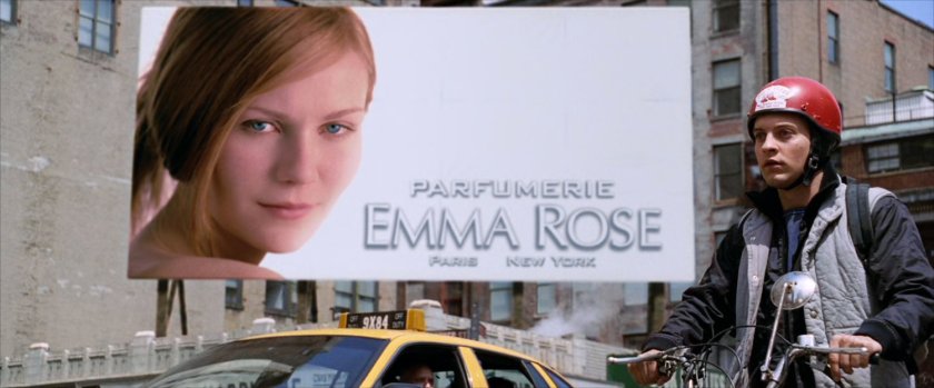 Peter Parker on moped and billboard with Mary Jane.