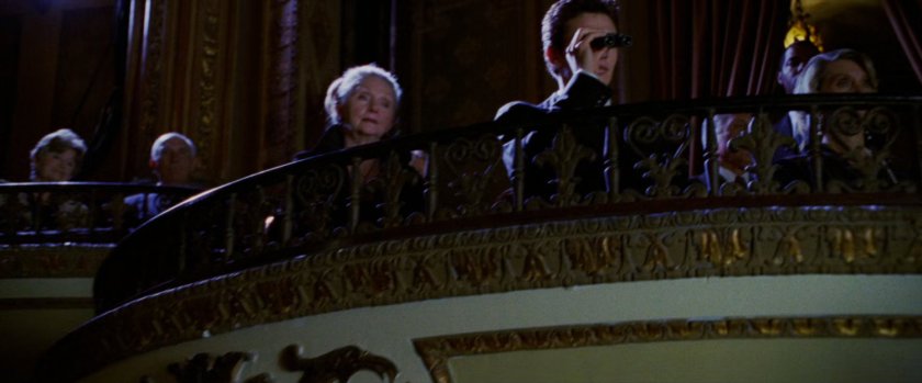 Harry Osborn in balcony inside theater.