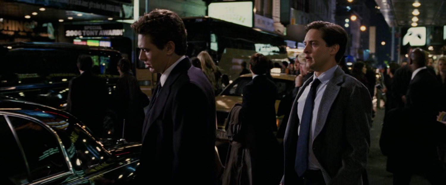 Harry Osborn and Peter Parker outside theater.