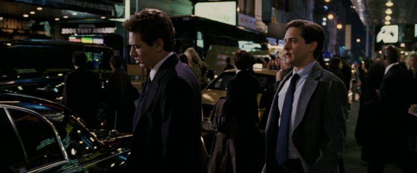 Harry Osborn and Peter Parker outside theater.