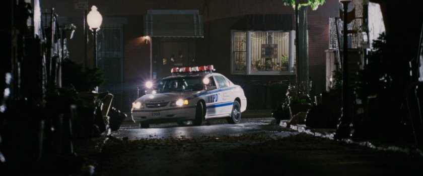 Police car on dark street.