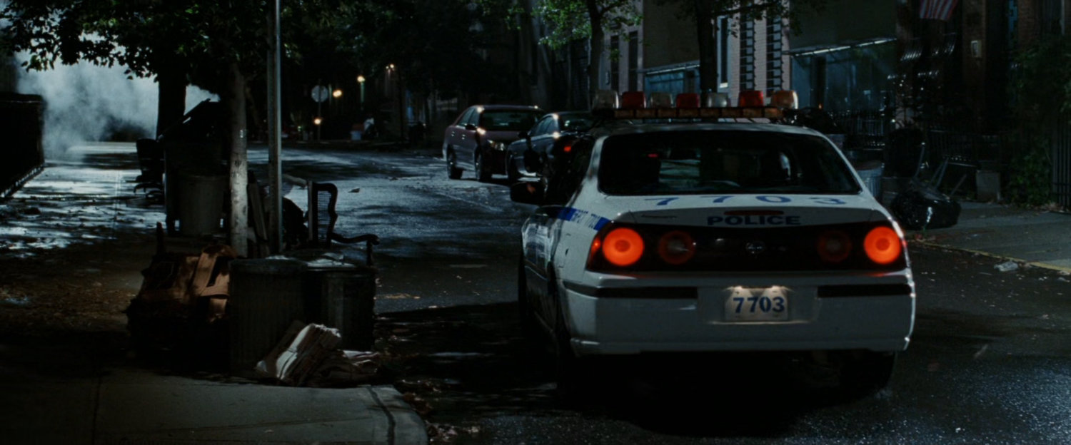Police car on dark street.