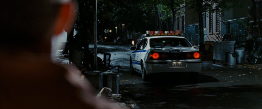 Police car on dark street.