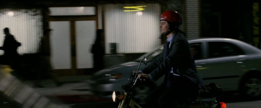 Peter Parker on Moped at night.