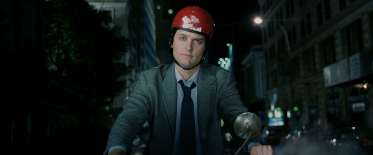 Peter Parker on Moped at night.