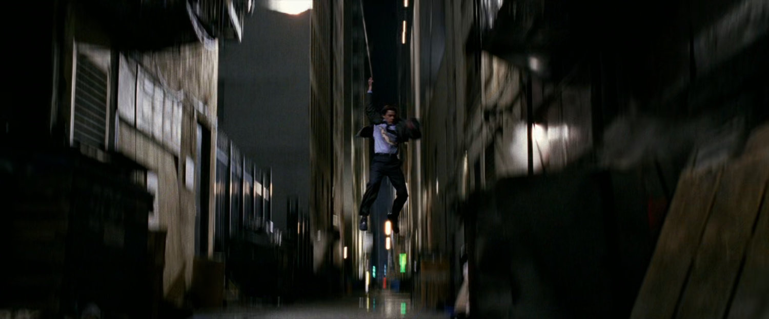 Peter parker landing in alley.
