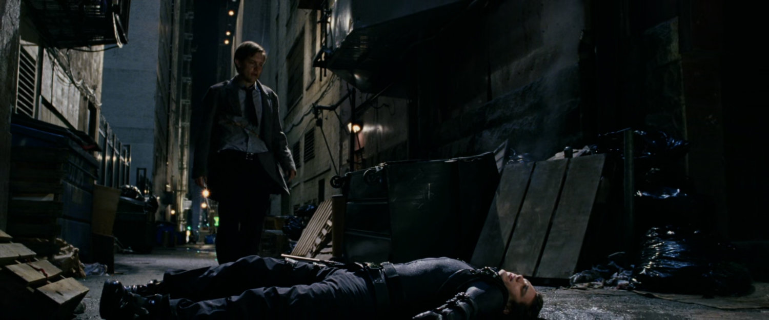 Peter Parker standing over New Goblin in alley.
