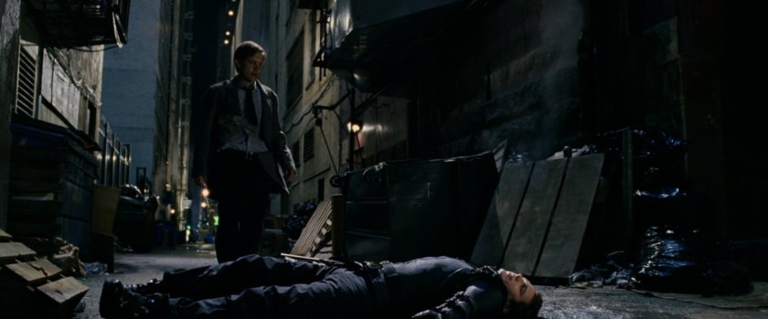 Peter Parker standing over New Goblin in alley.