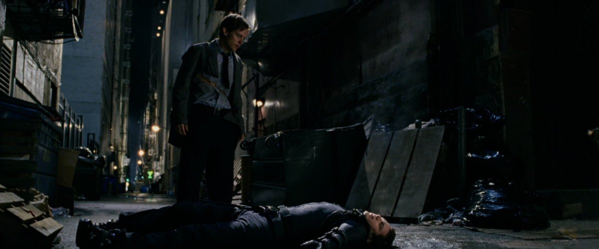 Peter Parker standing over New Goblin in alley.