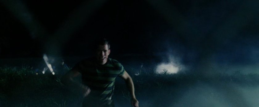 Exterior Marshlands with Flint Marko running from flashlights.