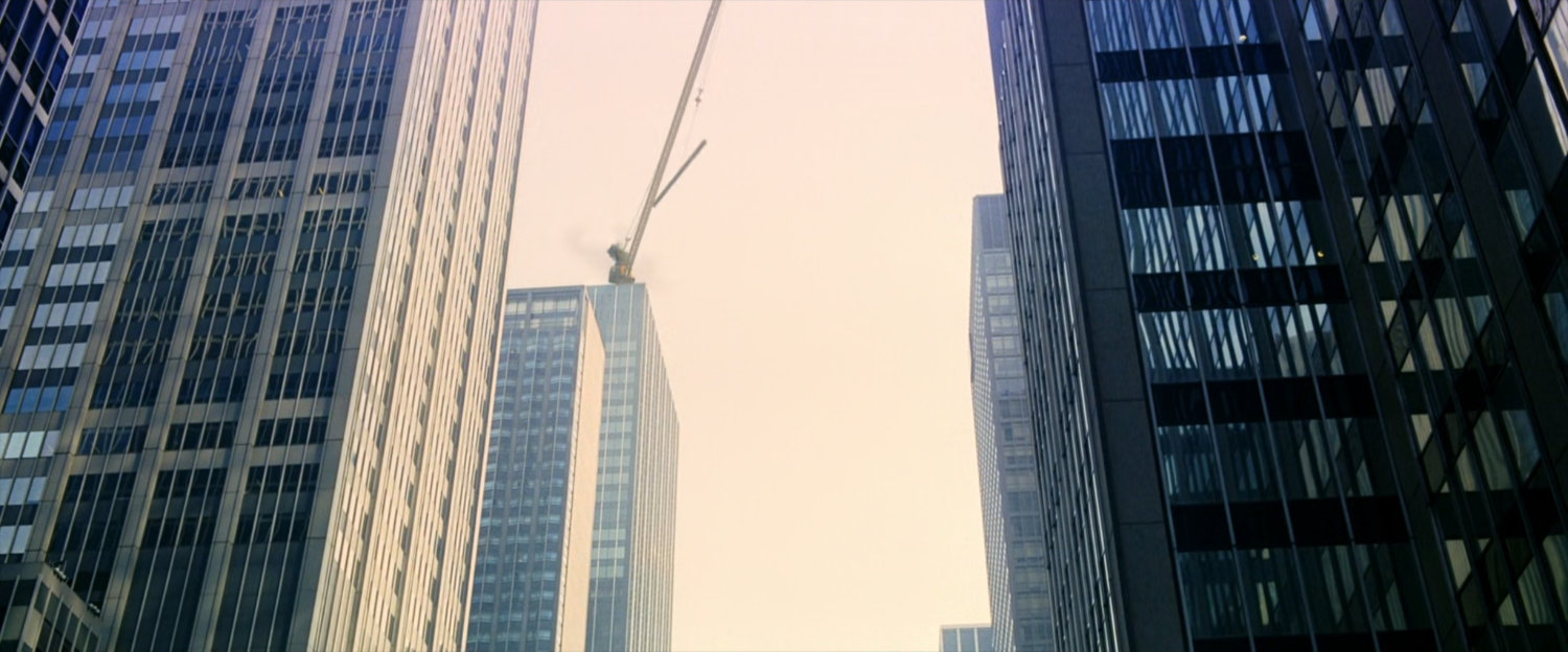 A crane on top of New York buildings.
