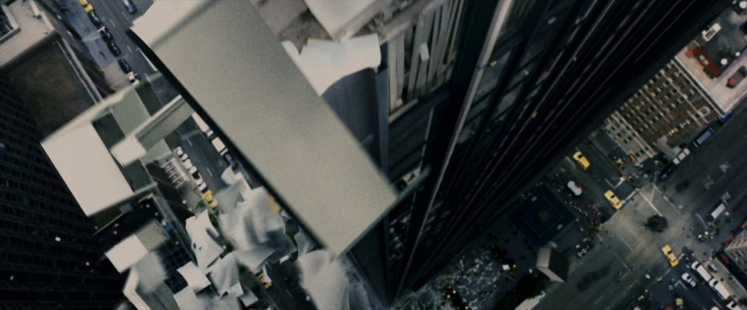 Debris falls from a skyscraper.