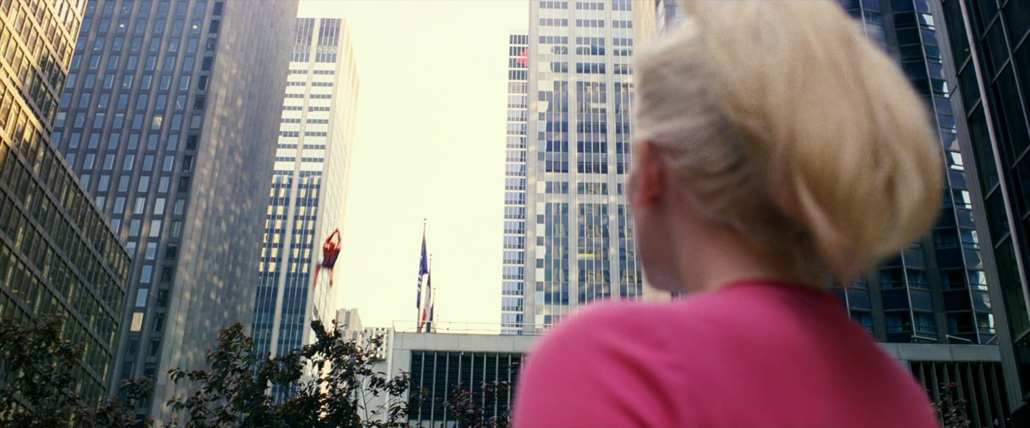 Gwen Stacy watches Spider-Man swing away.