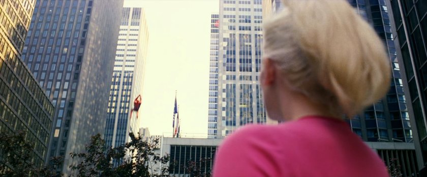Gwen Stacy watches Spider-Man swing away.
