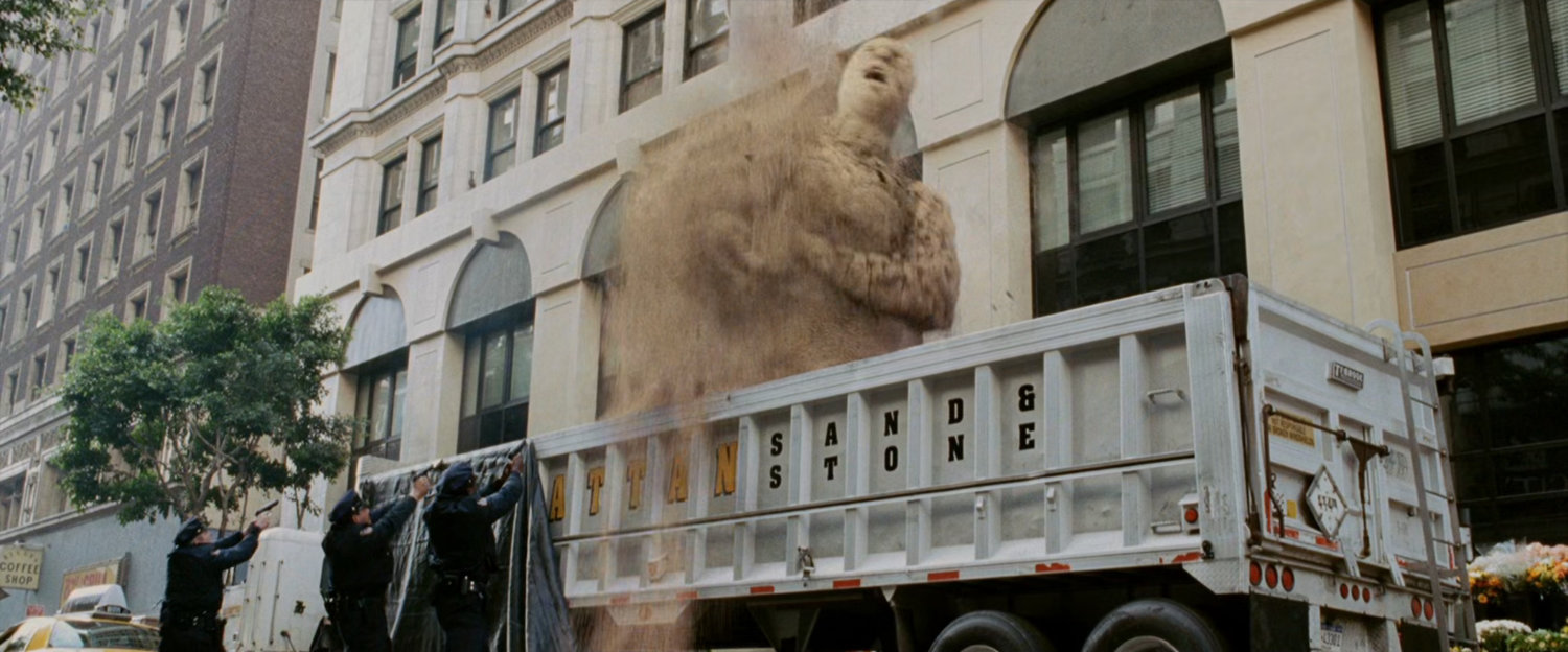 Sandman rises up out of truck.