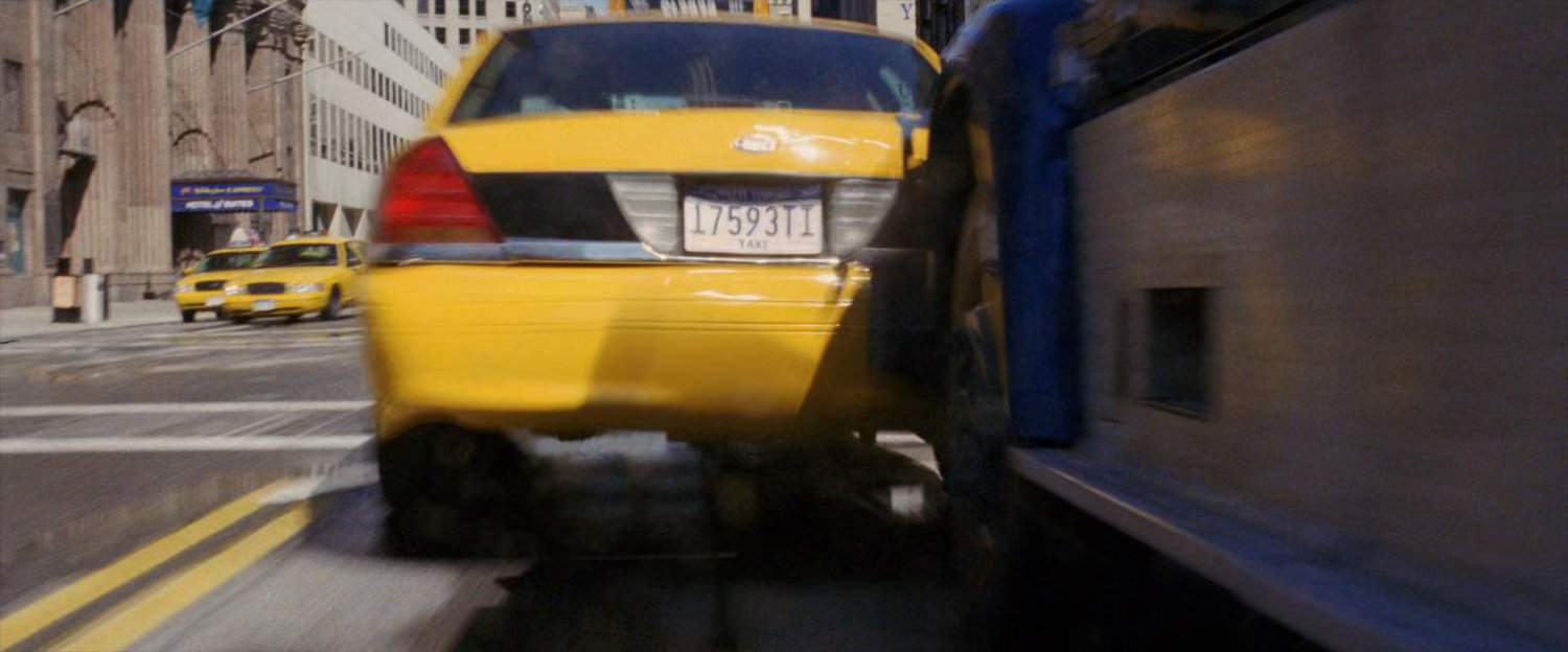 Yellow cab in the street hit by armored truck.