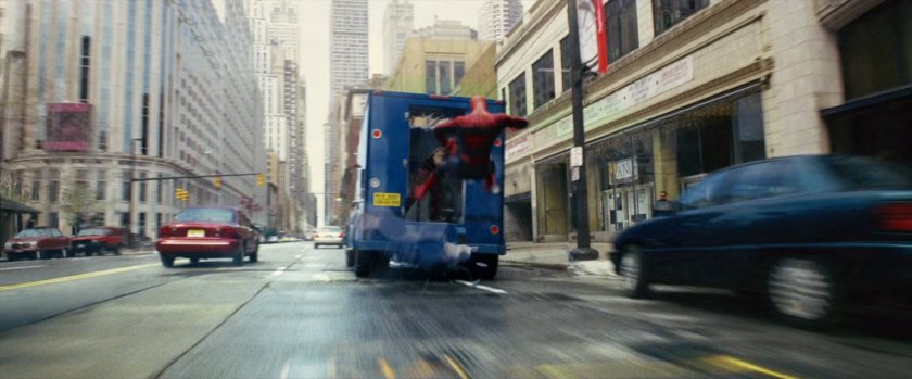 Spider-Man falls off of armored truck.