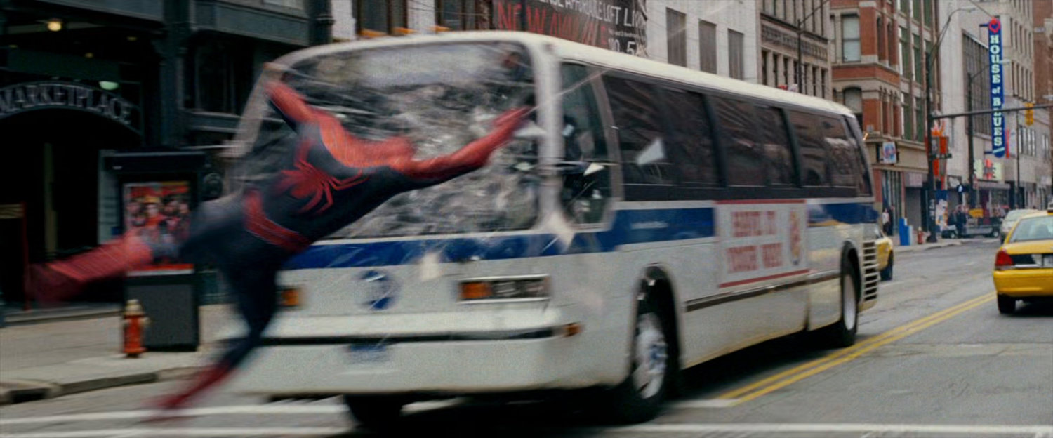 Spider-Man narrowly misses a city bus.