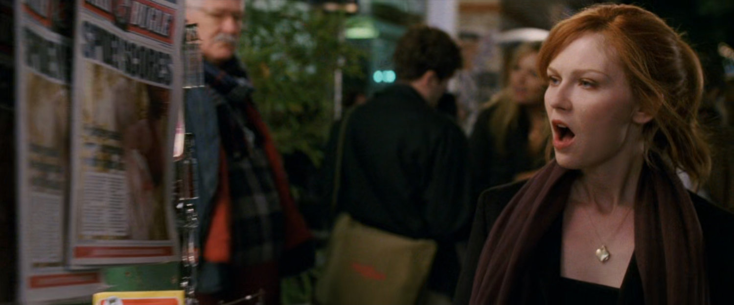 Mary Jane shocked at newspaper headline at newsstand.