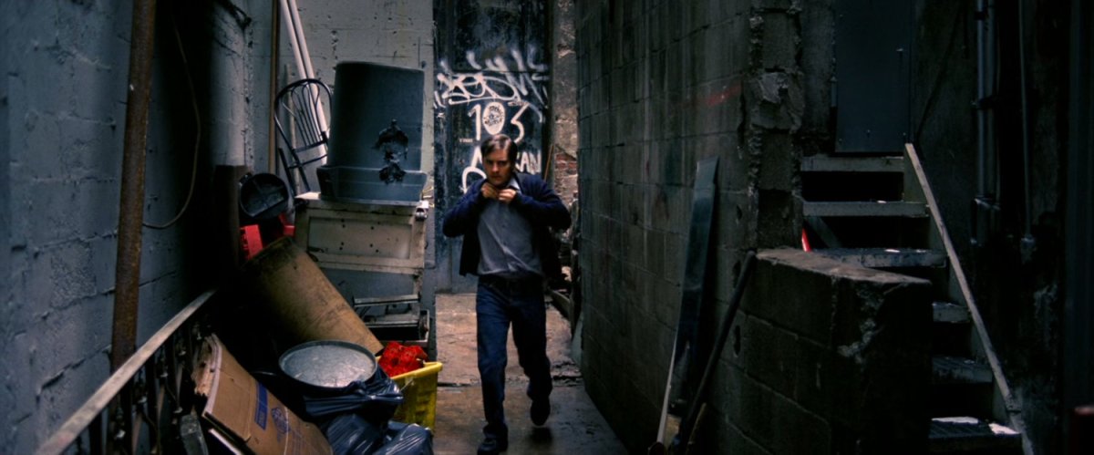 Peter Parker in dirty alley.