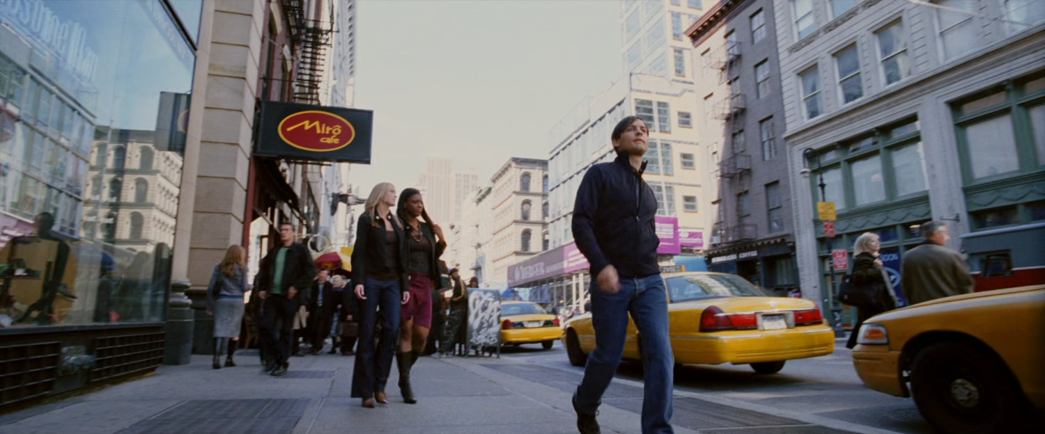 Peter Parker on sidewalk.