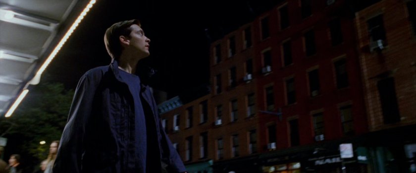 Peter Parker looking up at building.
