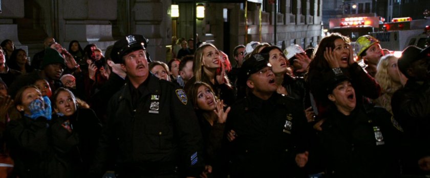 Crowd reacting to fight off screen.