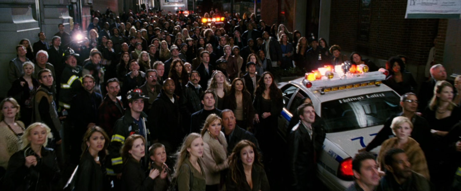 Crowd reacting to fight off screen.