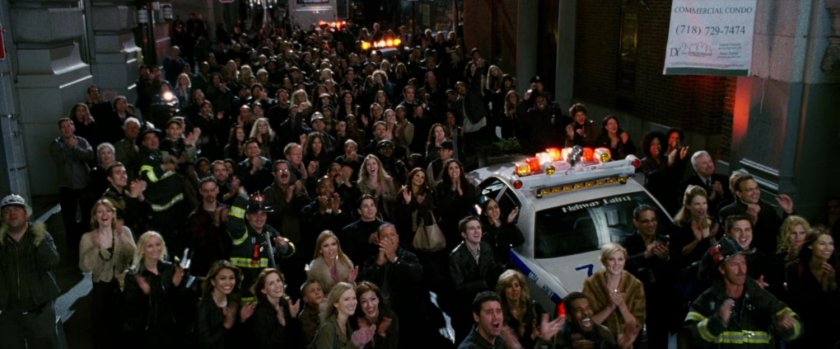 Crowd reacting to fight off screen.