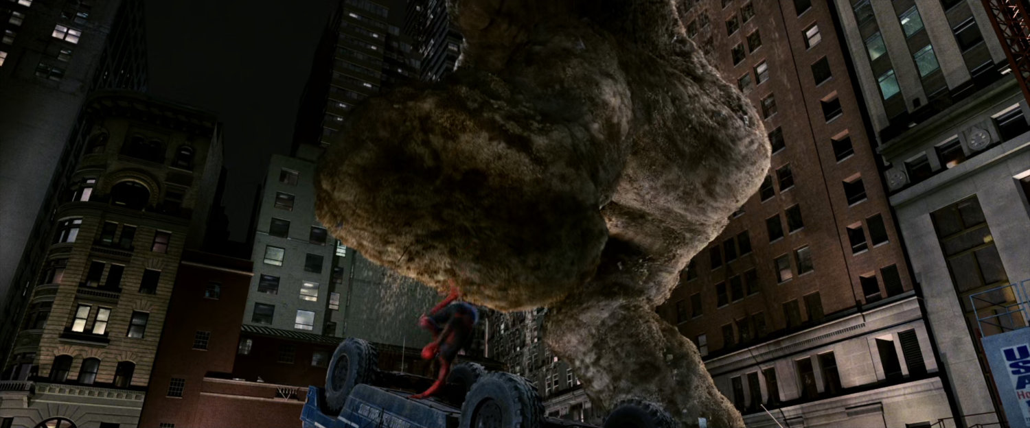 A large Sandman punches at Spider-Man at construction site.