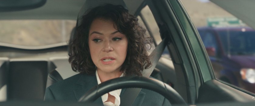Jen Walters driving in a car on the freeway.