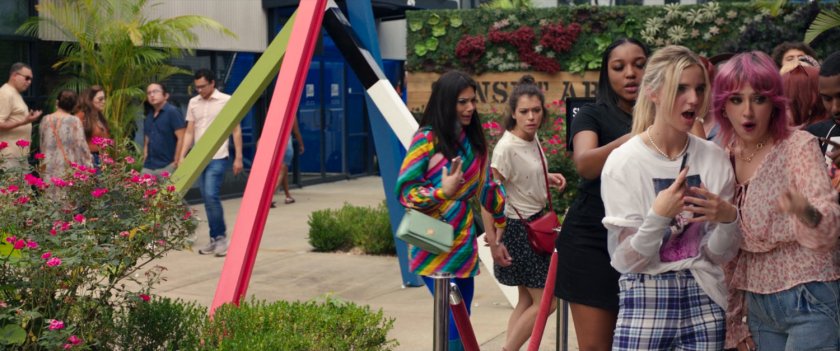 Jen and Nikki talk about Titania's usage of the She-Hulk name in a plaza outside a pop-up store.