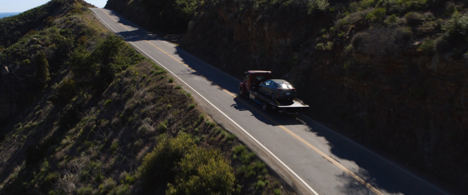 Drone shot of tow truck on Mulholland Highway.