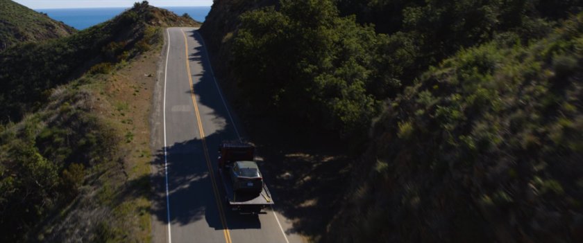 Drone shot of tow truck on Mulholland Highway.