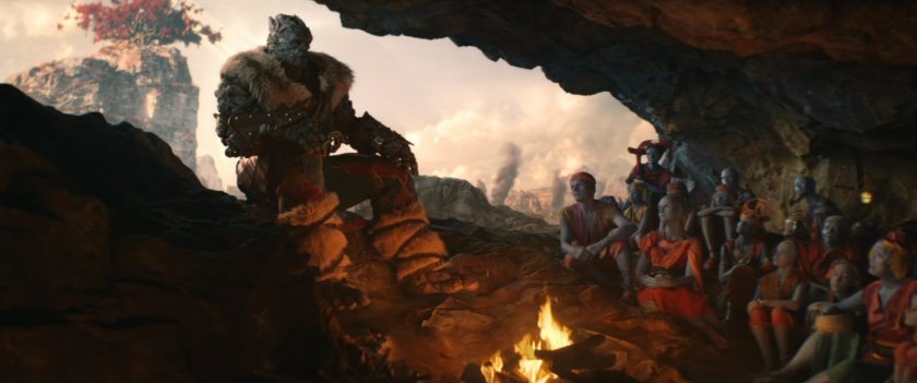 Korg sits in a cave on Indigarr and tells a story to young children.