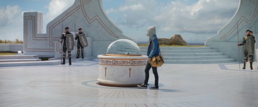 Jane stands before the shrine with the broken pieces of Mjolnir.