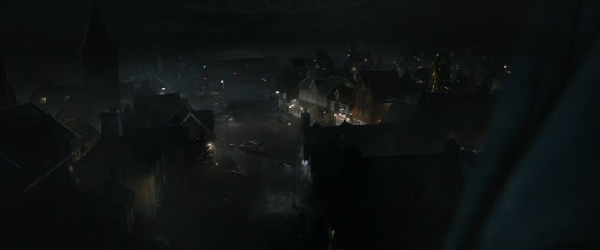 Foggy night time shot of the town of New Asgard.
