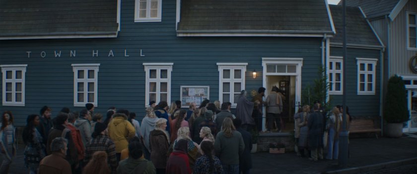 Villagers of New Asgard enter the Town Hall.