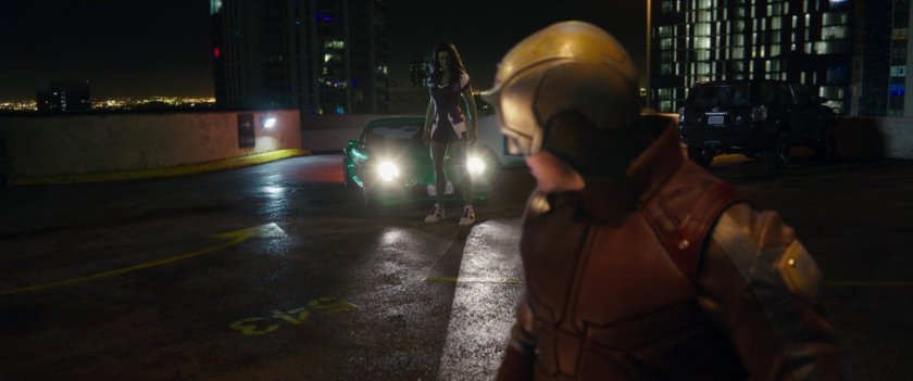 Daredevil looking at She-Hulk on a parking garage roof.