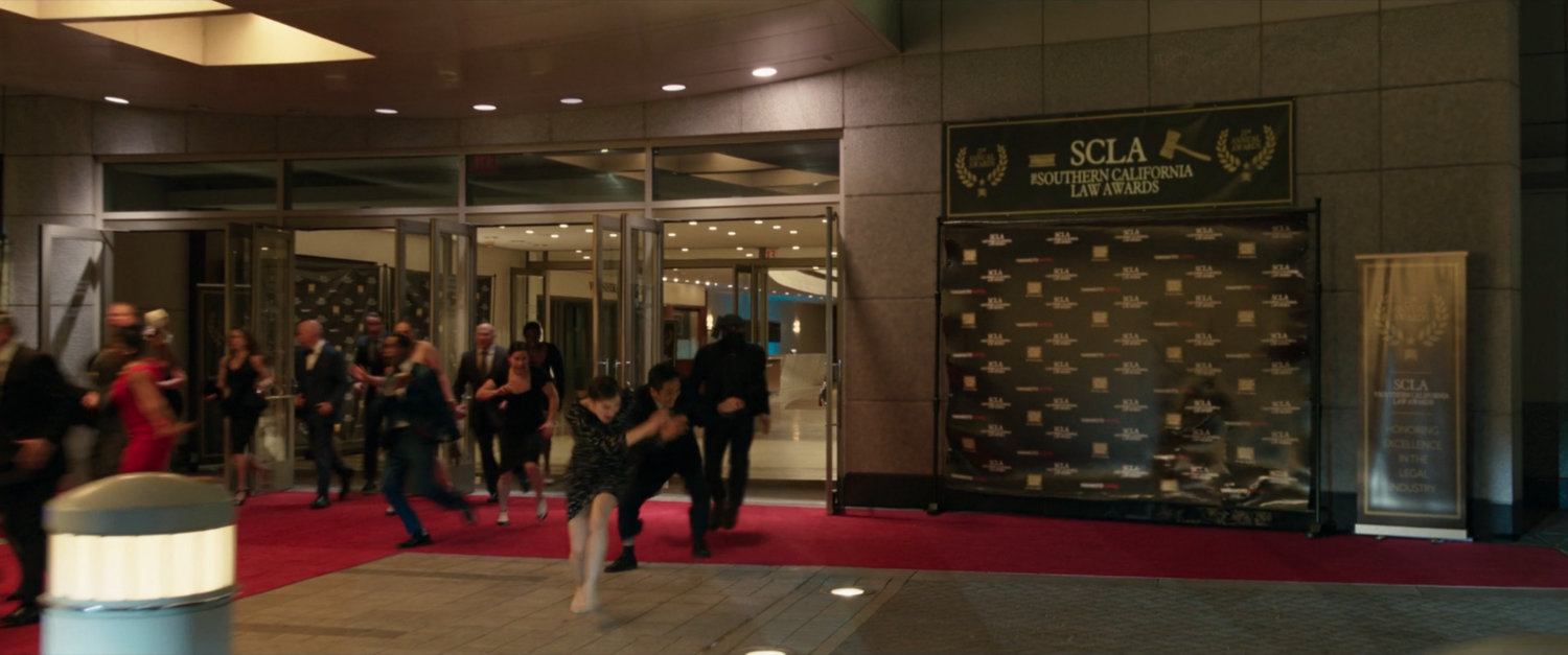 Panicked people leave the Wilshire Banquet Hall.