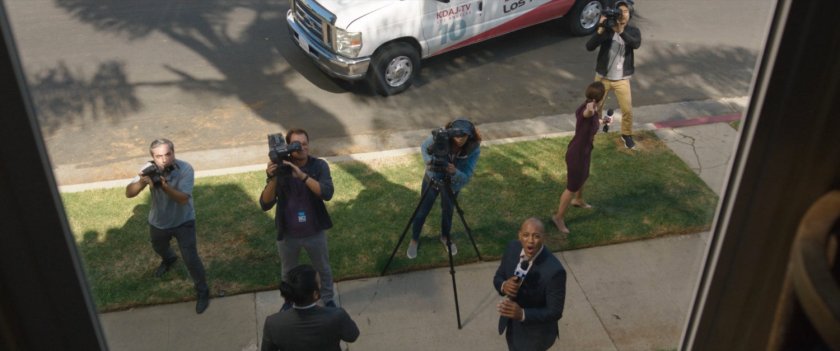 Reporters gather on the street below Jen Walters apartment.