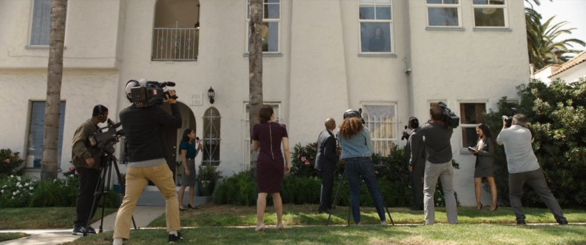 Reporters gather on the street below Jen Walters apartment.