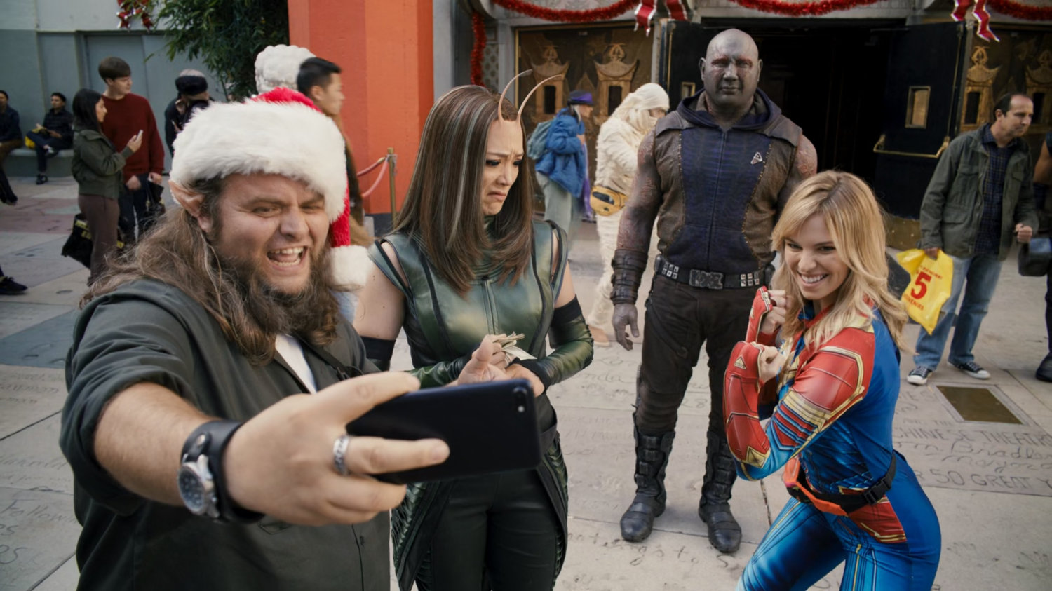 Mantis and Drax get photos taken with tourists, and a woman dressed as Captain Marvel.