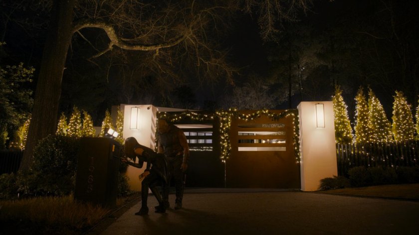 Mantis and Drax use the intercom outside Kevin Bacon's house.